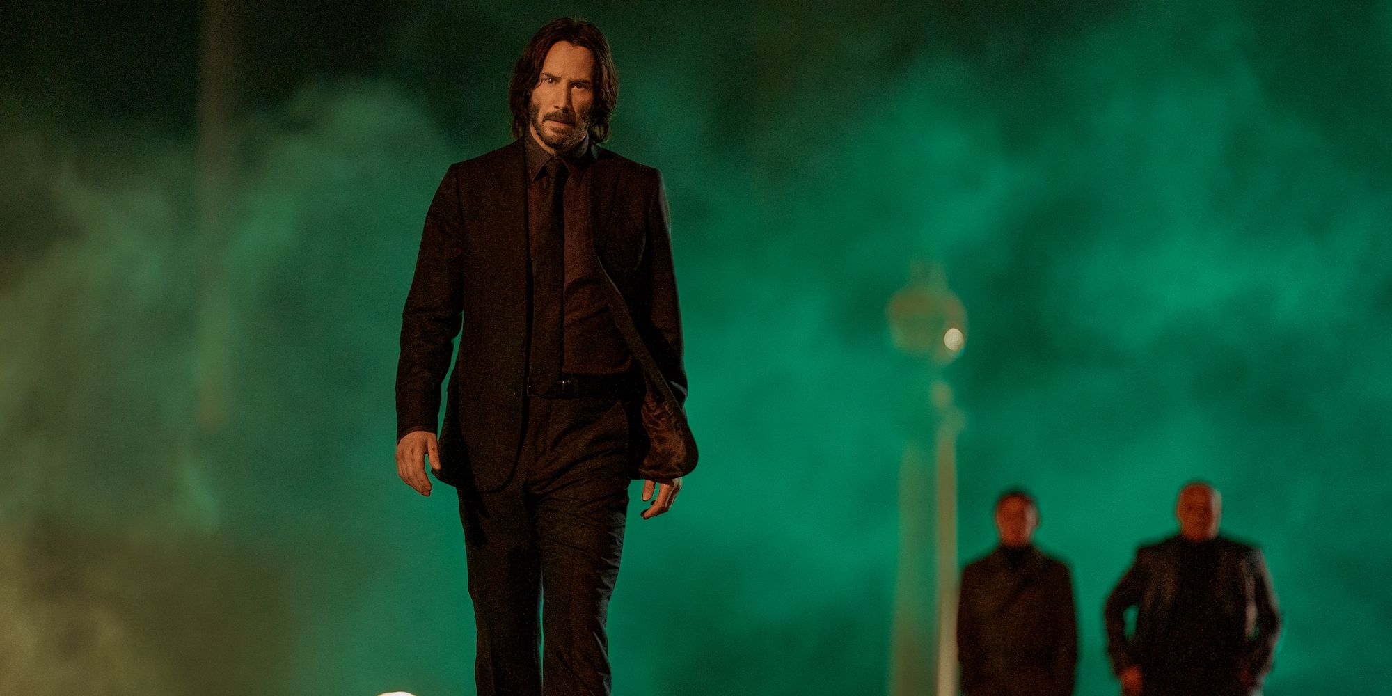 John Wick Chapter 4 Keanu Reeves is walking away from the smoke