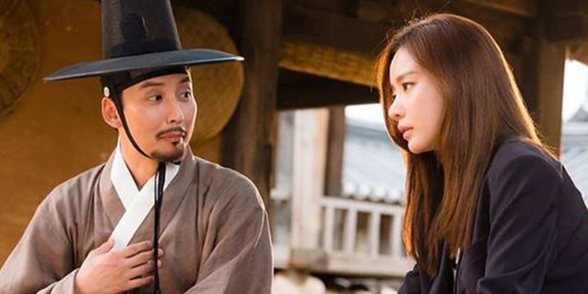 A man and woman are surprised in the Korean time travel drama Live Up To Your Name