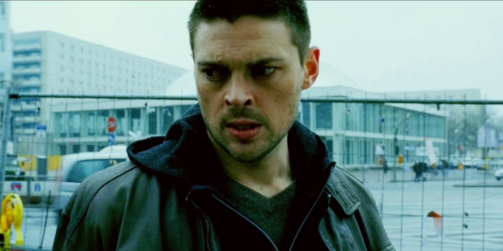 Kirill looking off-camera in The Bourne Supermacy.