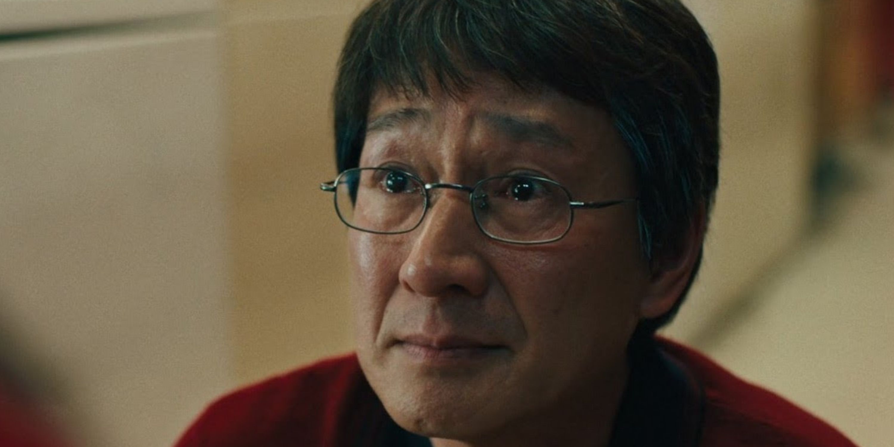 Ke Huy Quan as Waymond Wang looking sad in Everything Everywhere All at Once