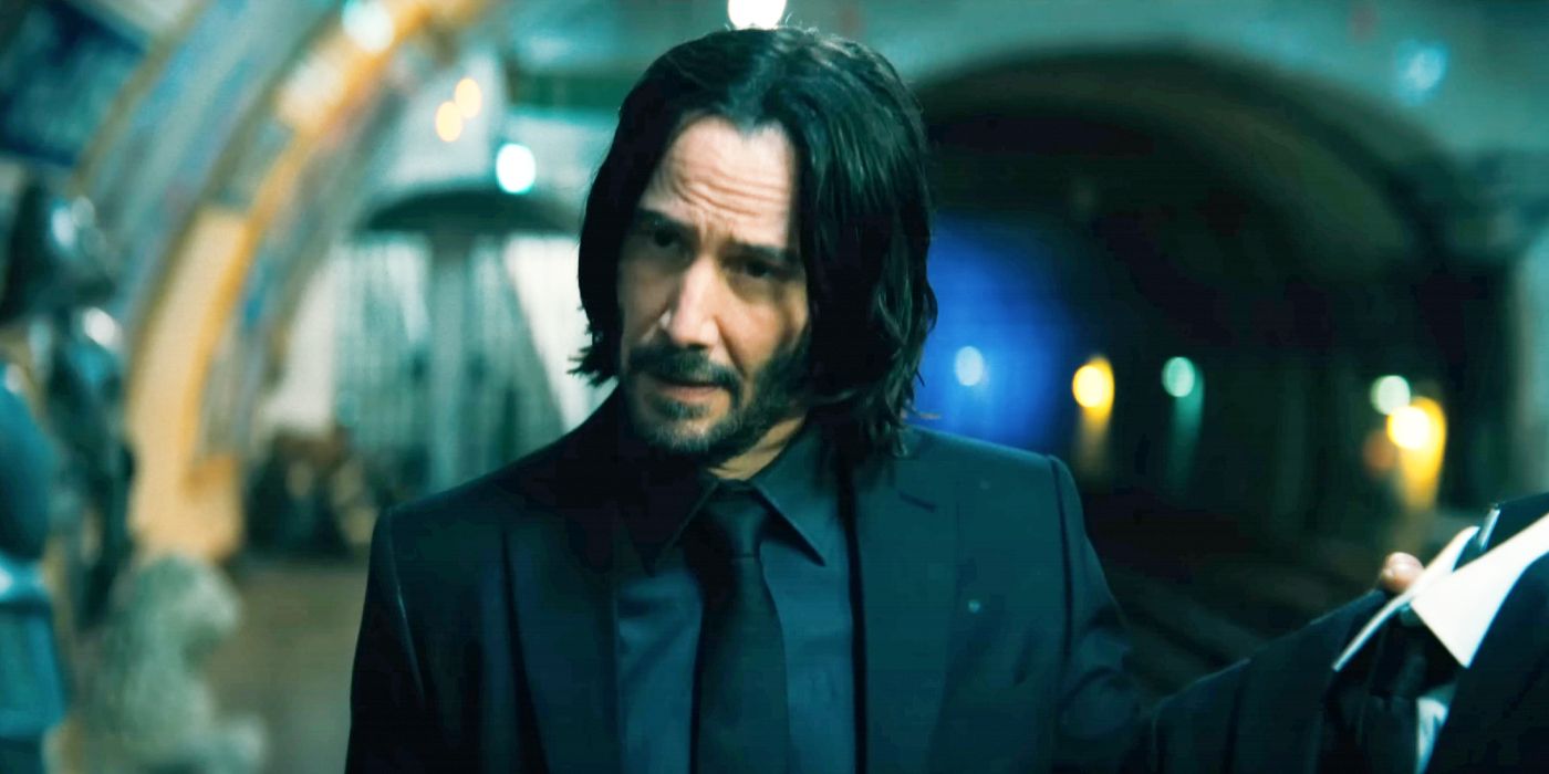 Keanu Reeves in John Wick Chapter 4 staring at a partner