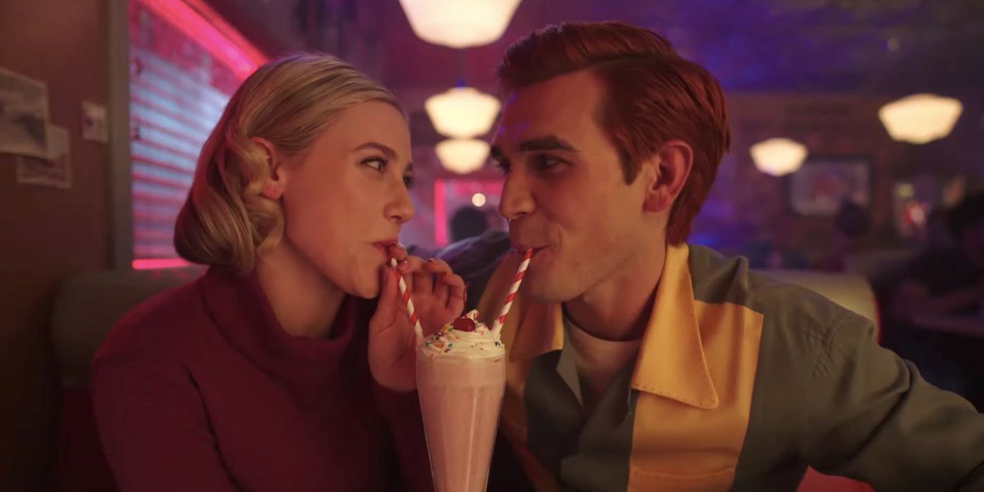 KJ Apa as Archie and Lili Reinhart as Betty Sharing a Milkshake in Riverdale Season 7