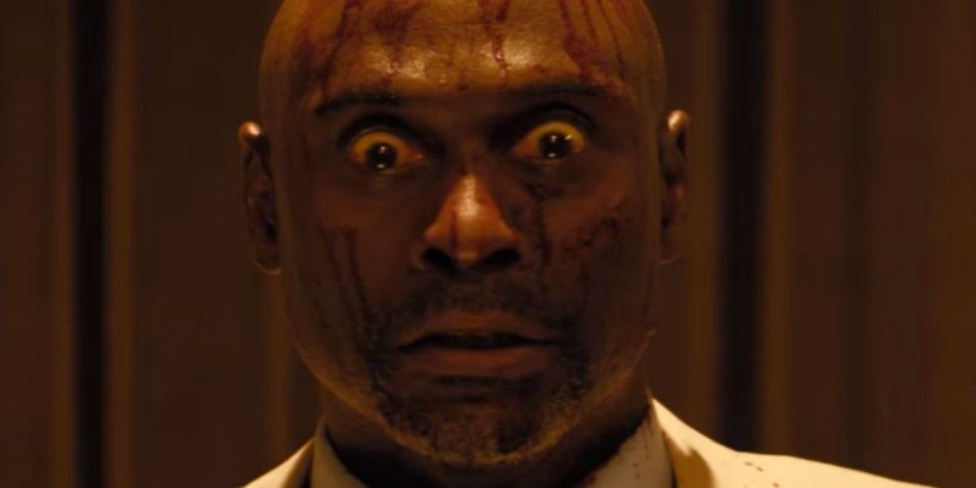 Lance Reddick covered in blood as Milo in Monster Party