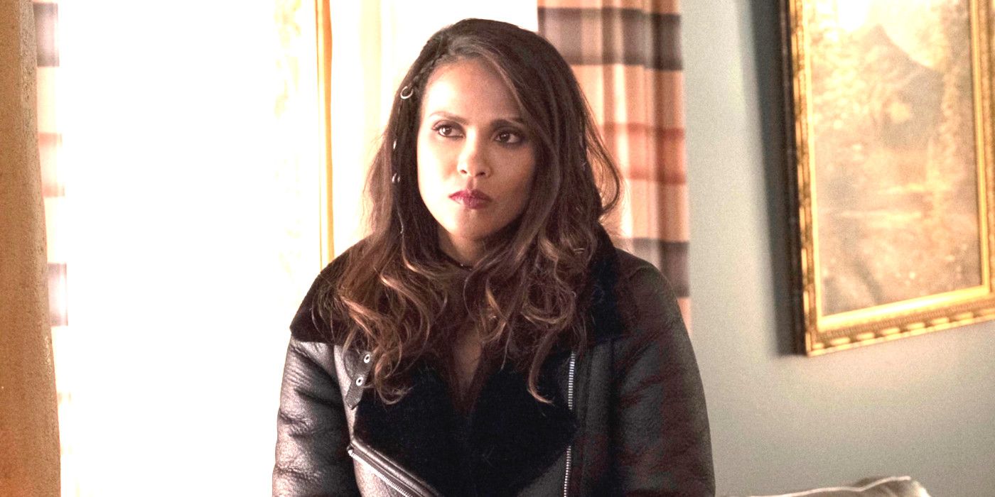 Lesley Ann Brandt As Maze In Lucifer standing in a living room looking stern