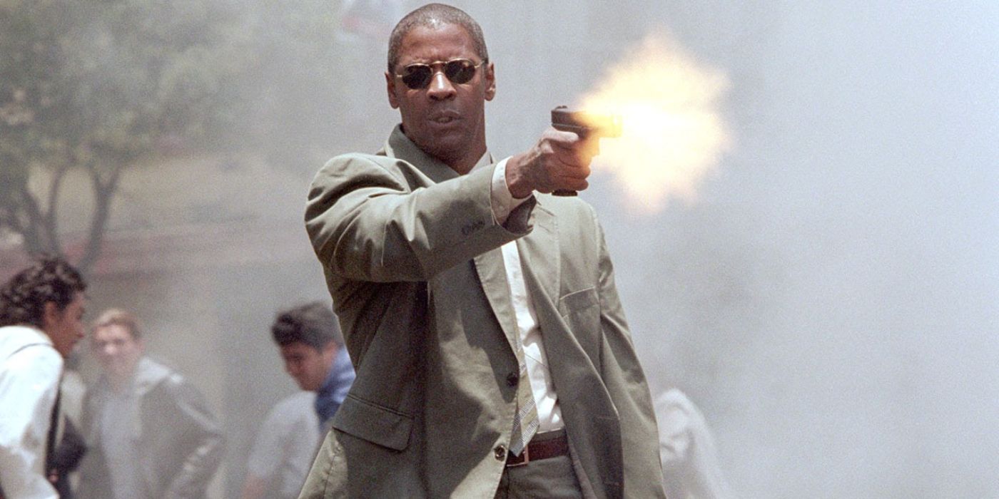 Denzel Washington as John Creasy Firing a Gun in Man on Fire