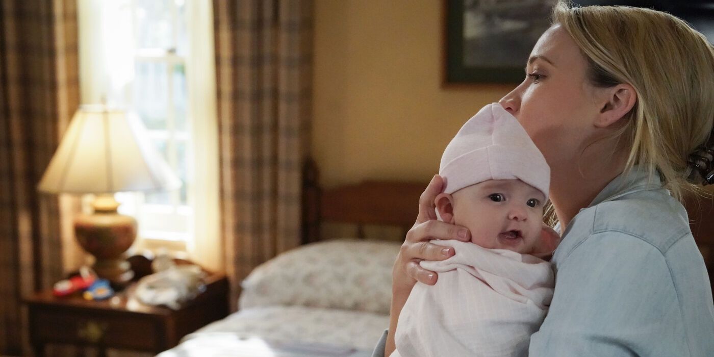 Mandy holding baby Constance back at home in Young Sheldon
