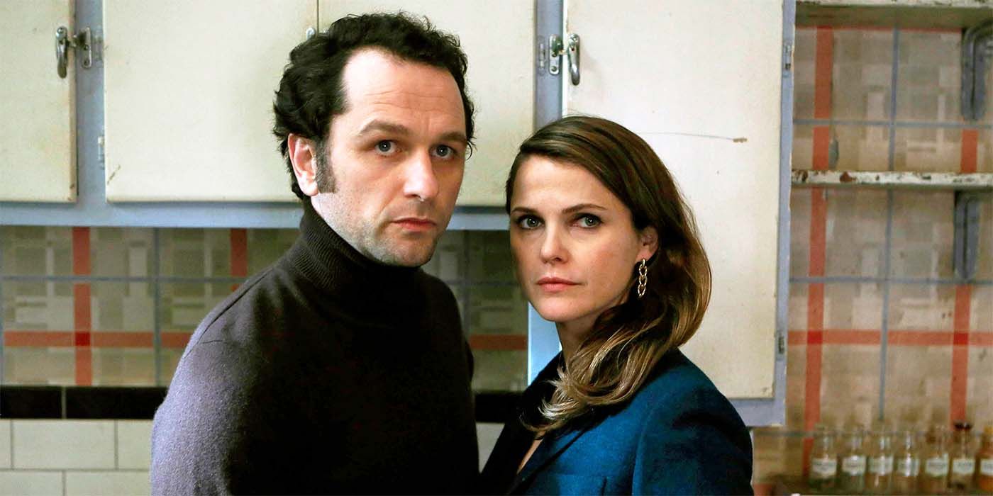 Matthew Rhys as Philip Jennings and Keri Russell as Elizabeth Jennings looking suspiciously off-camera in The Americans