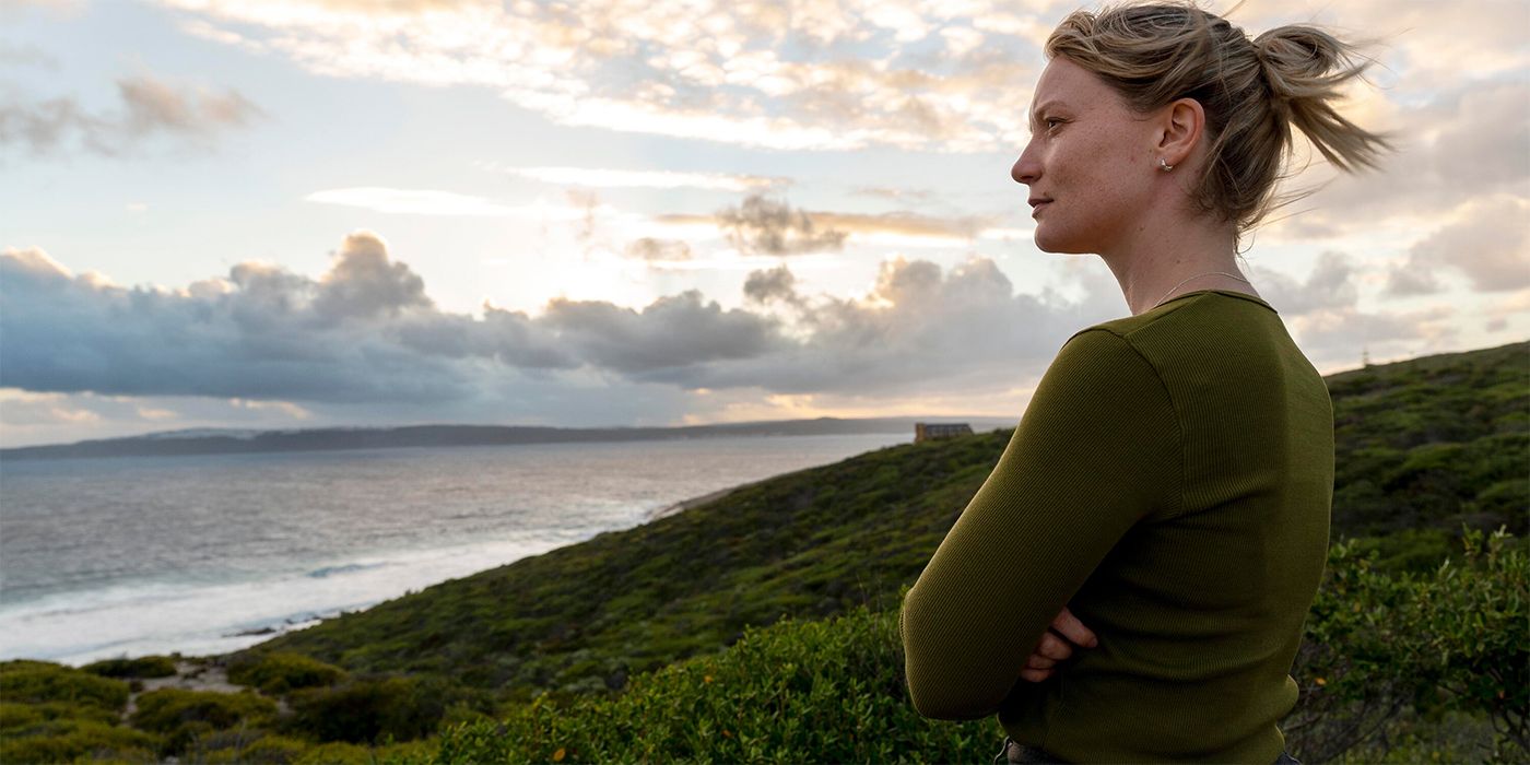 mia wasikowski looks at ocean in blueback