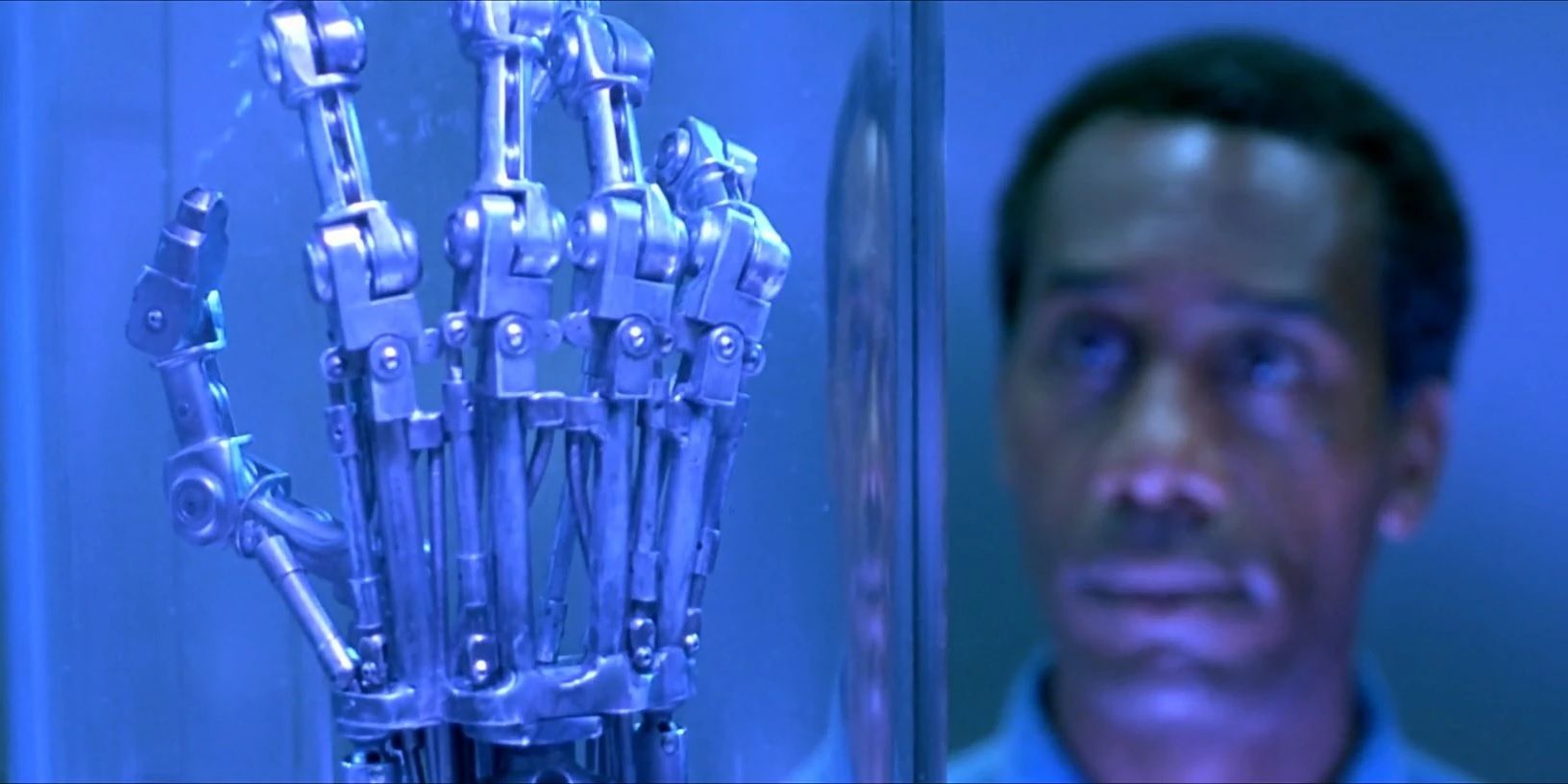 Miles Dyson looking at a Terminator hand in Terminator 2