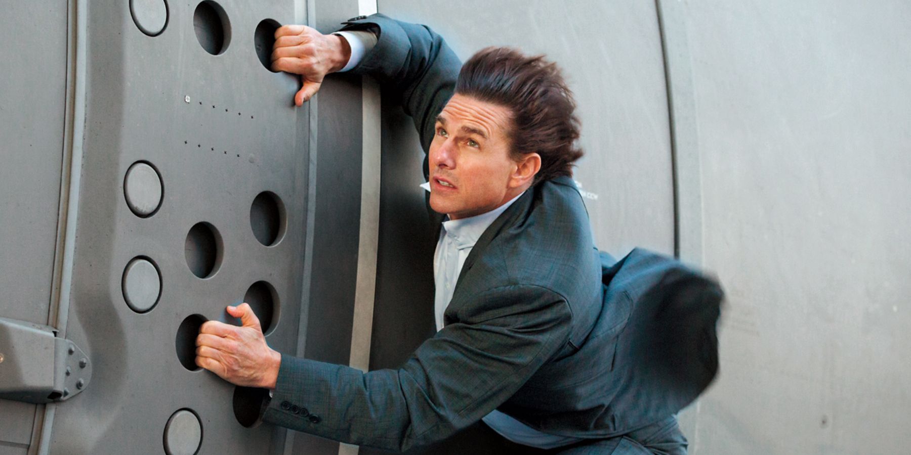 Ethan Hunt holding onto a plane in Mission Impossible Fallout 