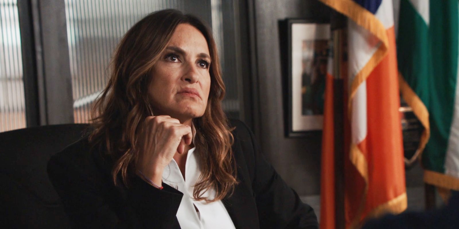 Olivia Benson sitting in her office in Law and Order SVU.