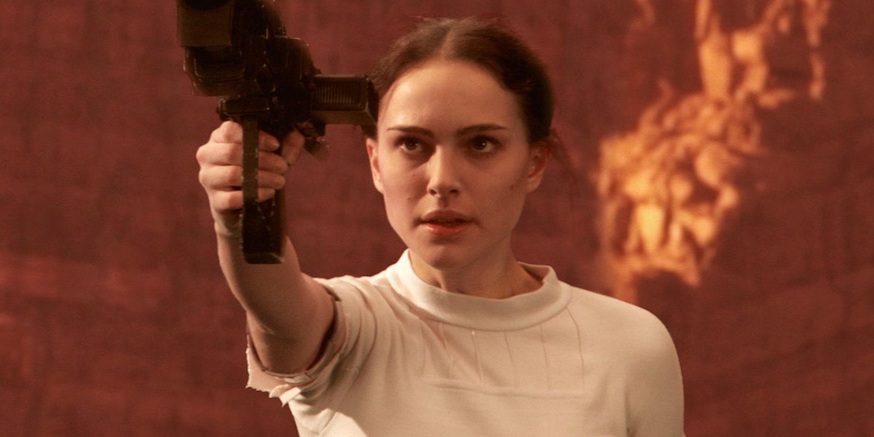 Padme with a blaster in Attack of the Clones.