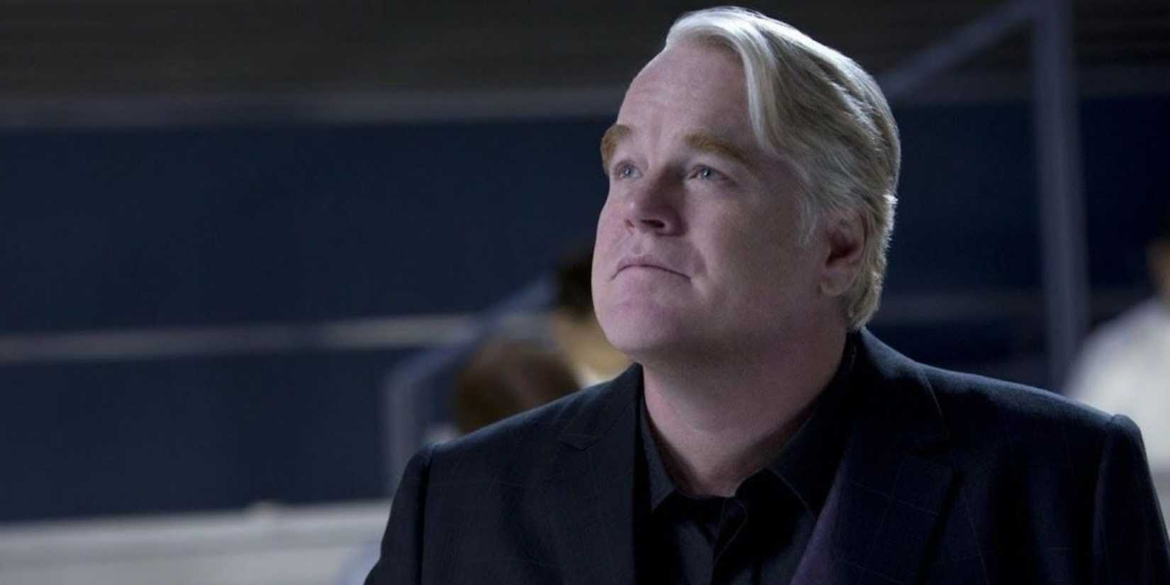 Philip Seymour Hoffman as Plutarch Heavensbee looking upwards in Mockingjay Part 2