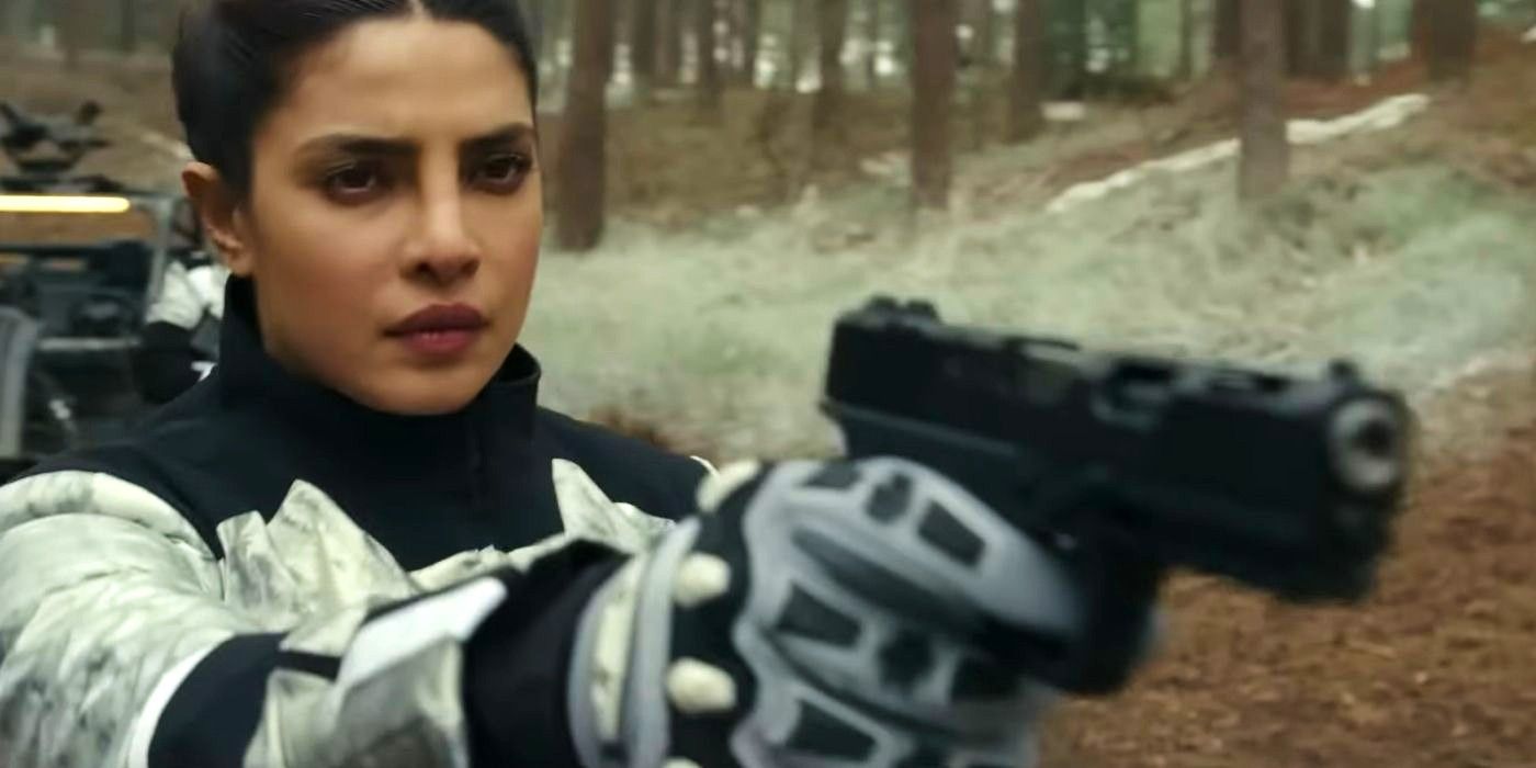 Nadia Sinh holding up a gun in the forest in the Citadel