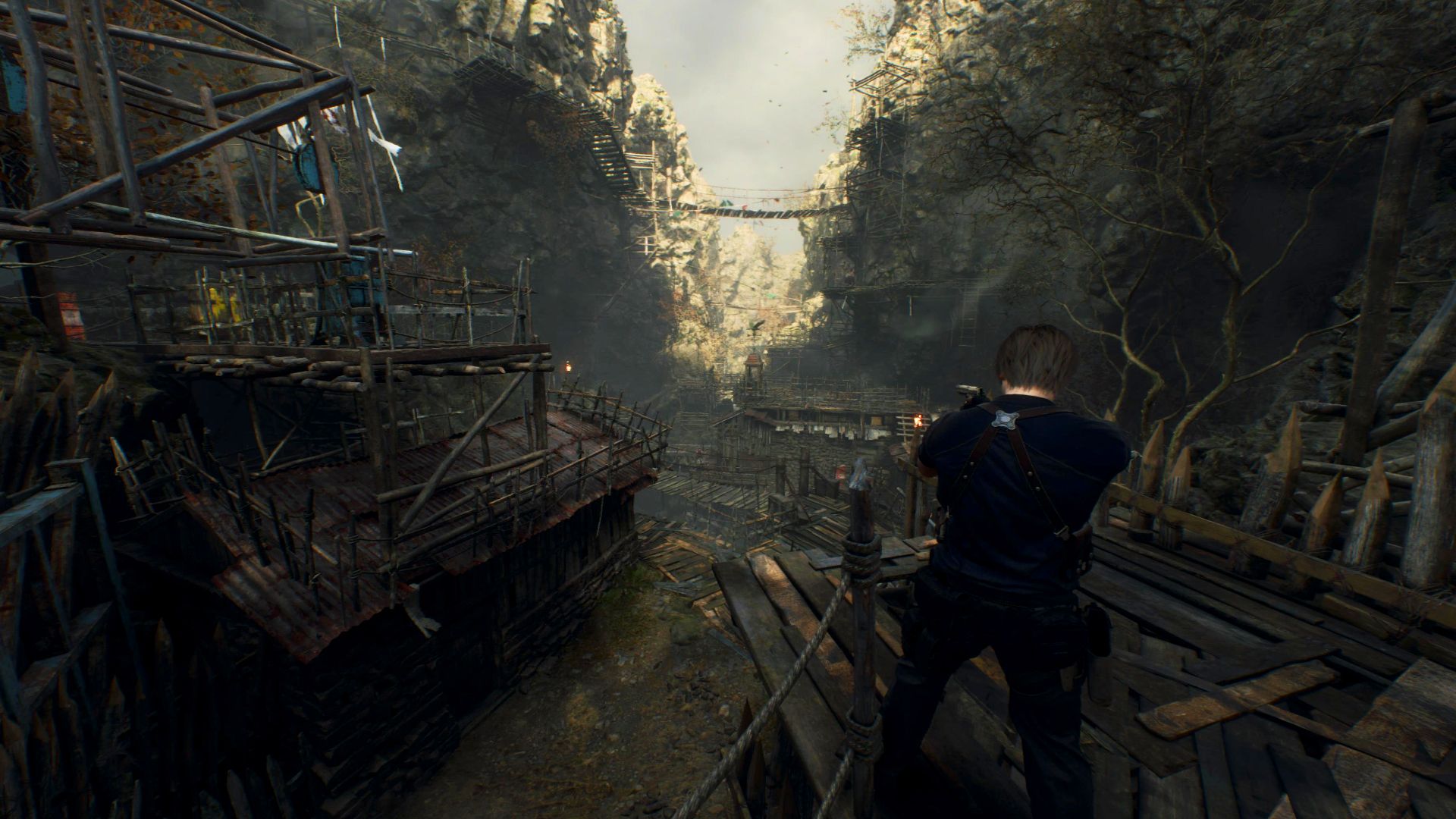 Leon stands high atop a stilt village in Resident Evil 4's remake