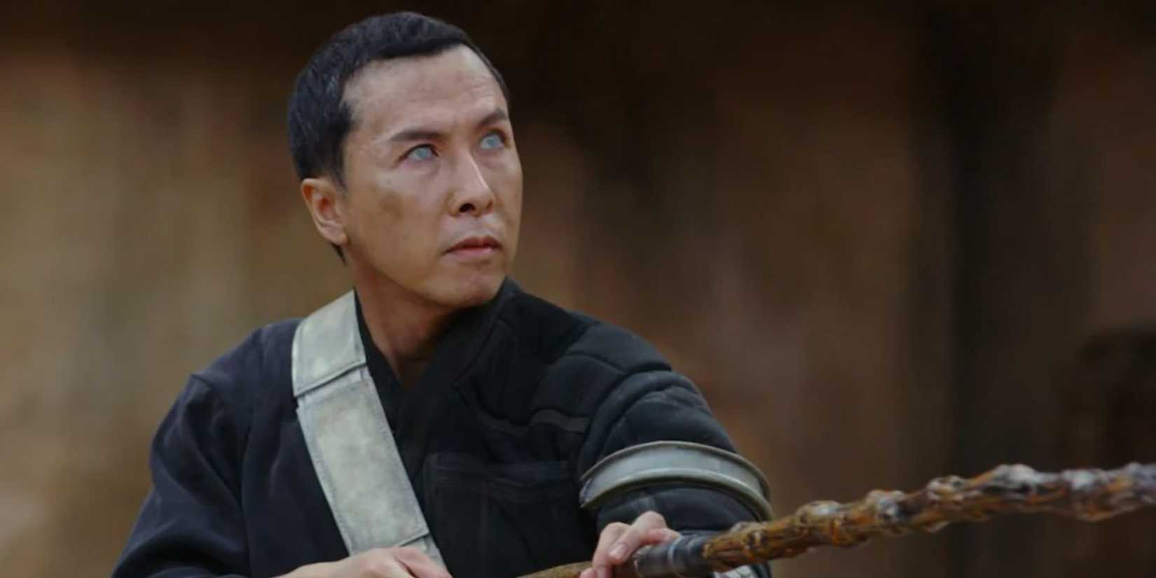 Donnie Yen as Chirrut with his stick up in Rogue One A Star Wars Story