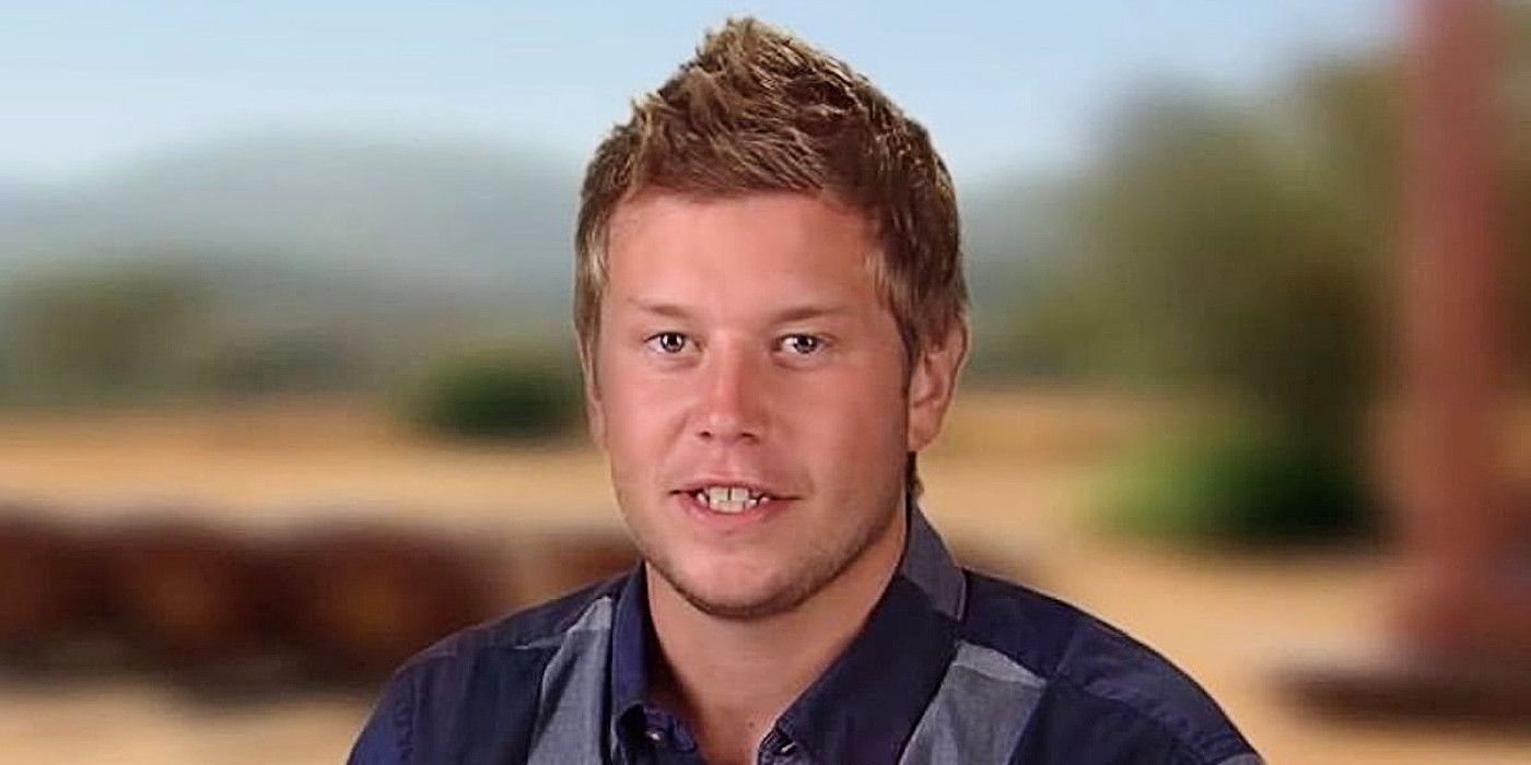 Ryan Knight on The Challenge. He is facing the camera, sitting against a blurred background of a desert environment. 
