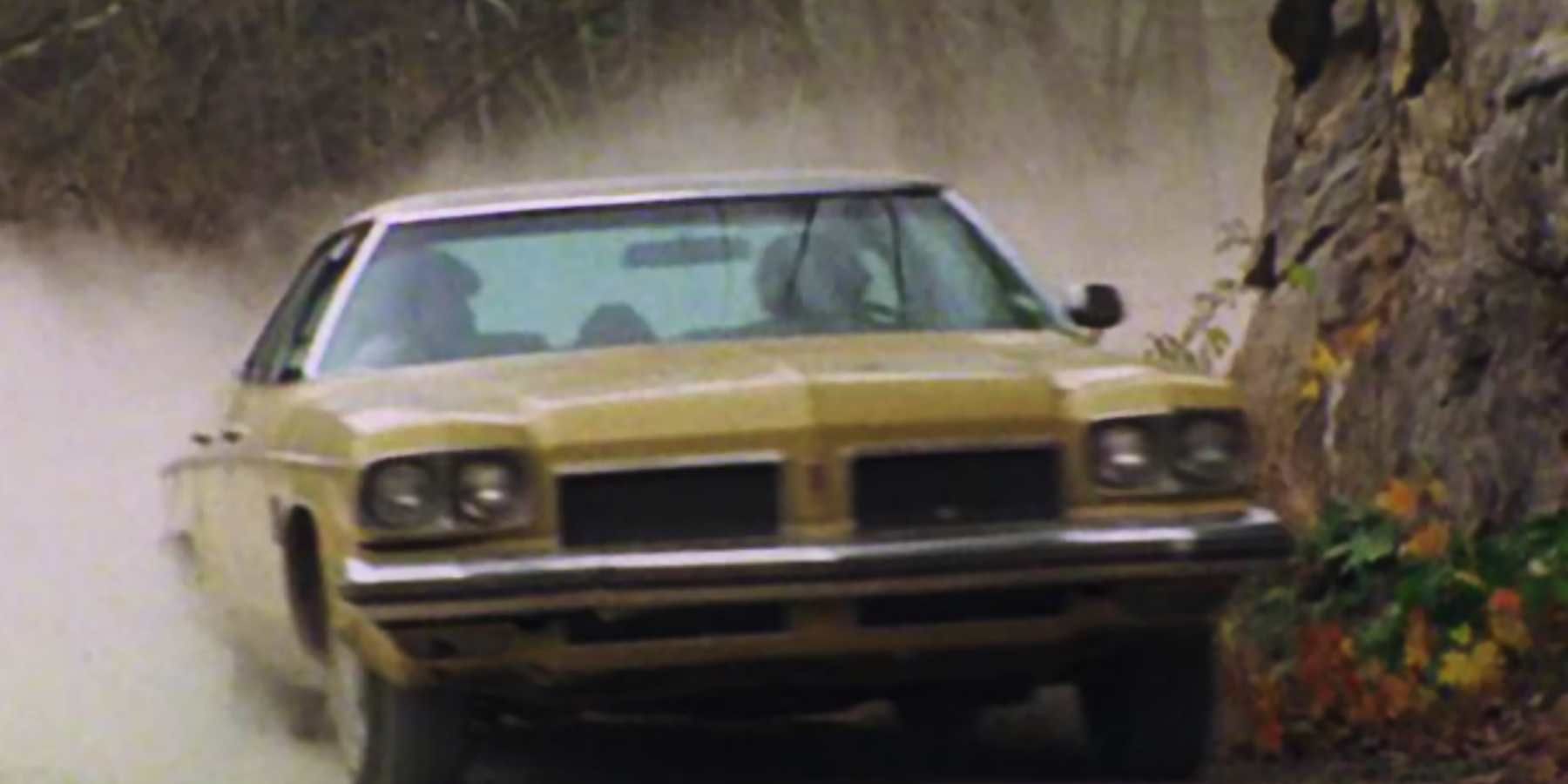 Ash drives the Oldsmobile to the cabin in The Evil Dead