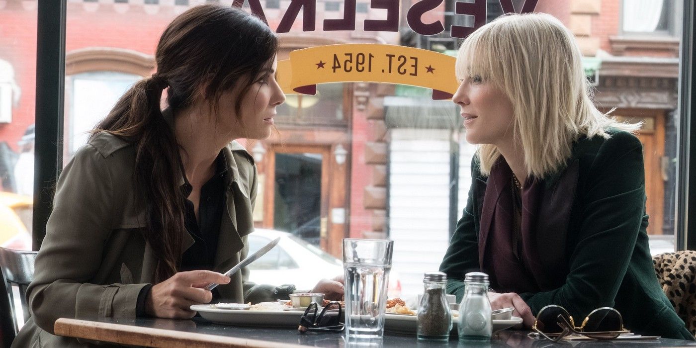 Sandra Bullock and Cate Blanchett sitting in a cafe in Ocean's 8