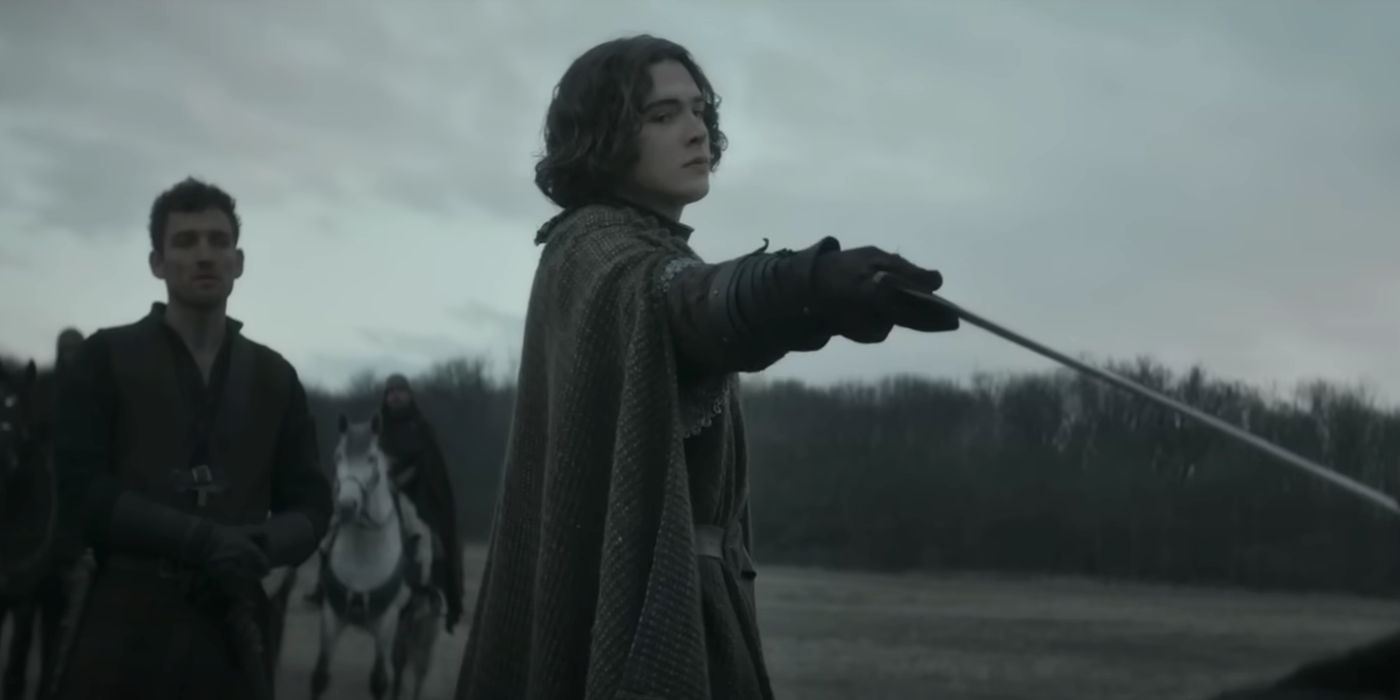 Aethelstan (Harry Gilby) raising his sword in the Seven Kings Must Die trailer.