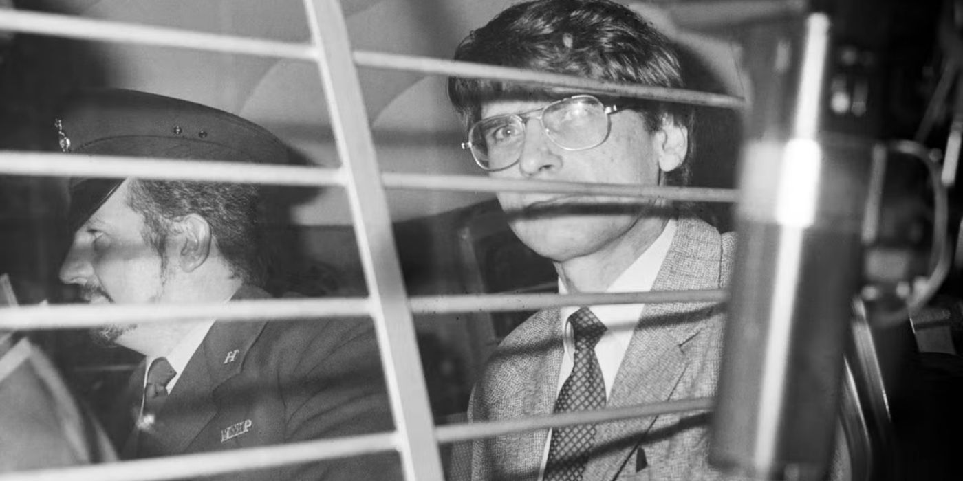 Serial killer Dennis Nilsen in a police car in black and white