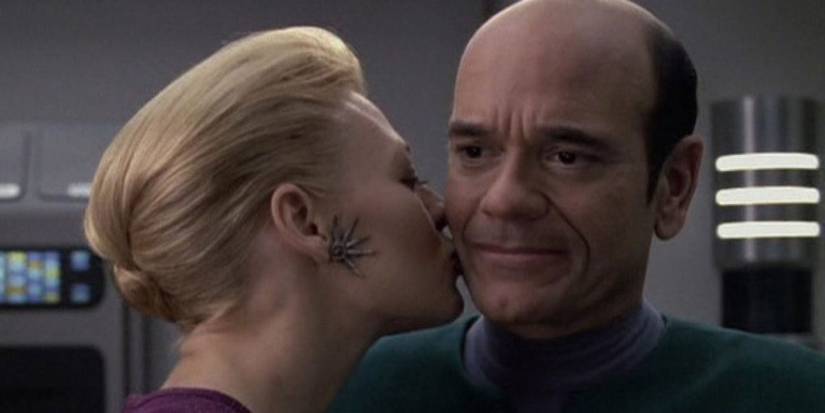 Seven Of Nine kisses the Doctor's cheek in the Star Trek: Voyager episode "Tinker, Tenor, Doctor, Spy"