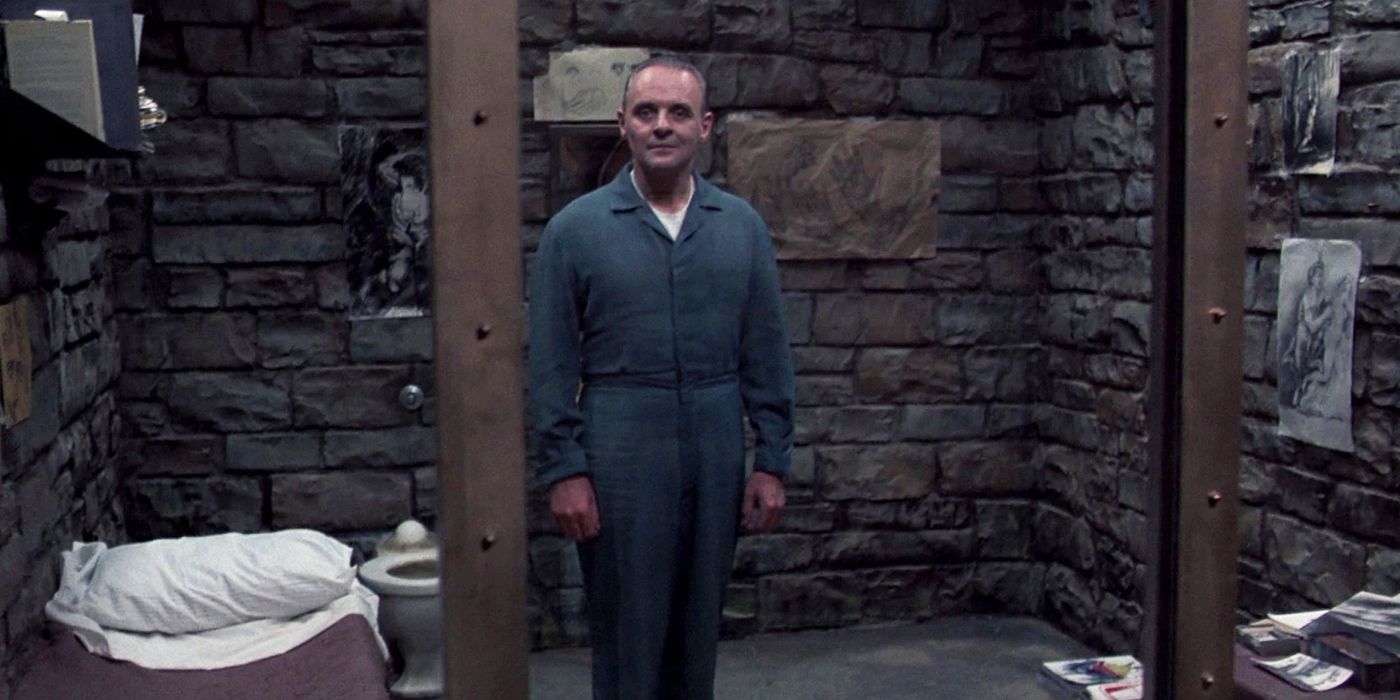 Sir Anthony Hopkins as Hannibal Lecter standing inside his cell in The Silence of the Lambs