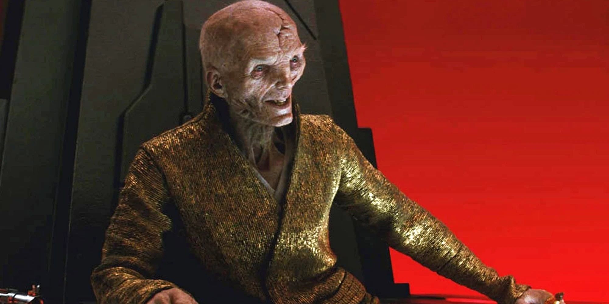 Snoke grinning on his throne in The Last Jedi.