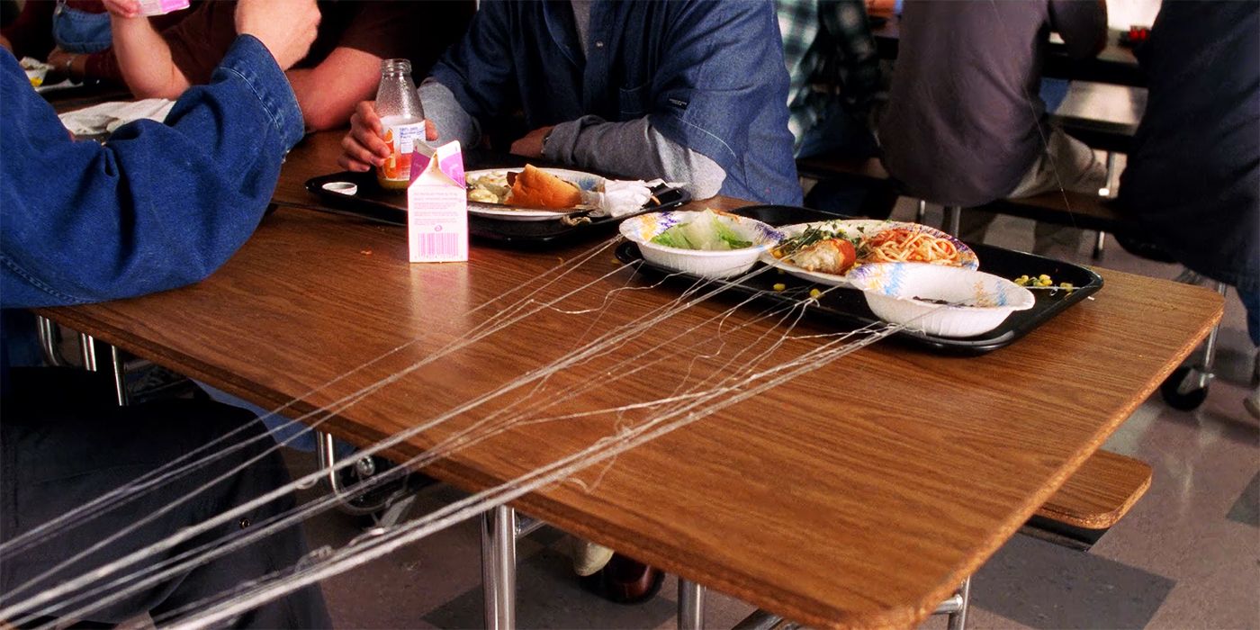 Webs extending from trays in Spider-Man 2002 cafeteria scene