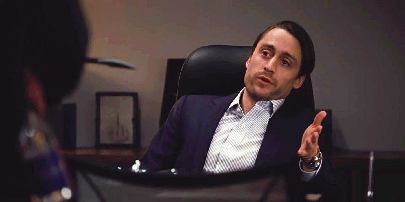 Roman Roy (Kieran Culkin) in Succession gesturing behind a desk