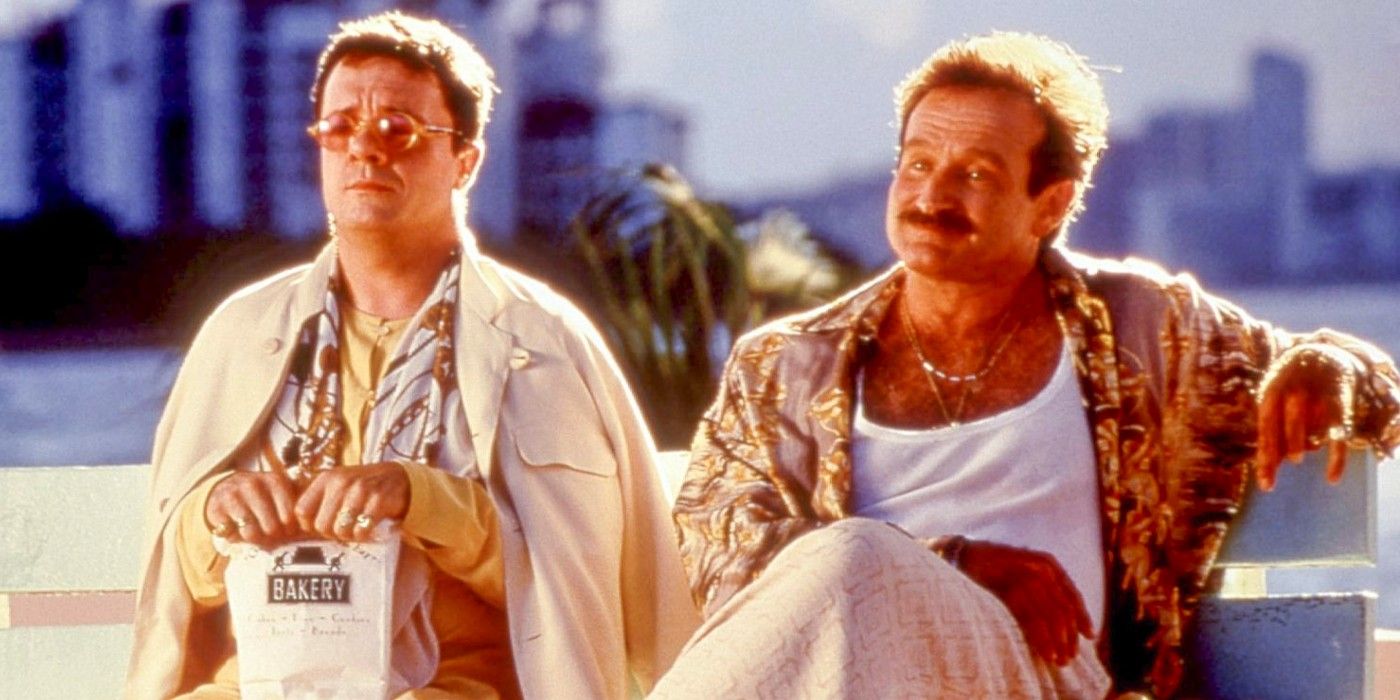 Robin Williams and Nathan Lane sitting on a bench in The Birdcage