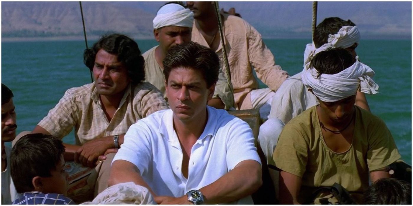 The cast of Swades sitting on a boat