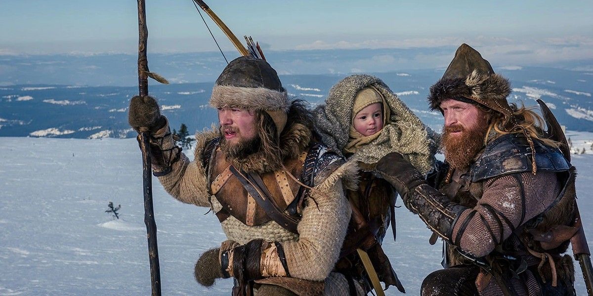 Two Vikings in the snow with a baby The Last King