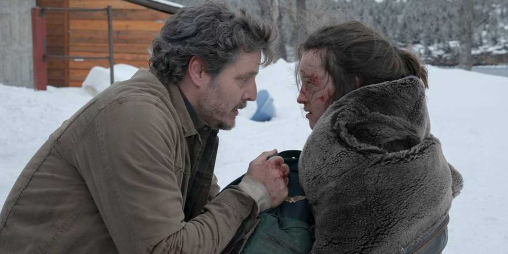 Joel and Ellie staring at each other outside in the snow in The Last of Us episode 8.