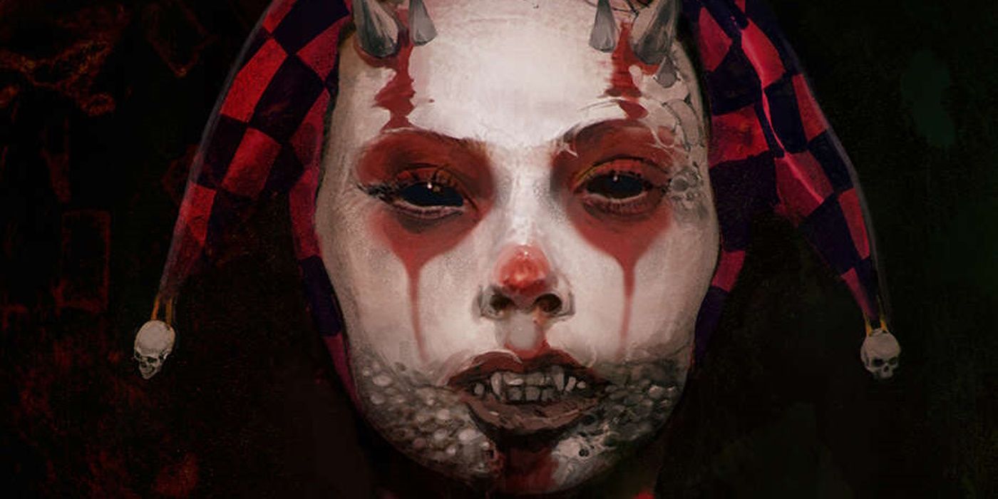 Close up of a female harlequin  with jet black eyes, horns and sharpened teeth