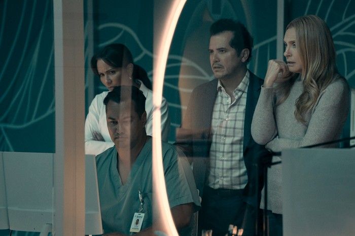 The Power&rsquo;s John Leguizamo and Toni Collette looking at results in a doctor&rsquo;s office.