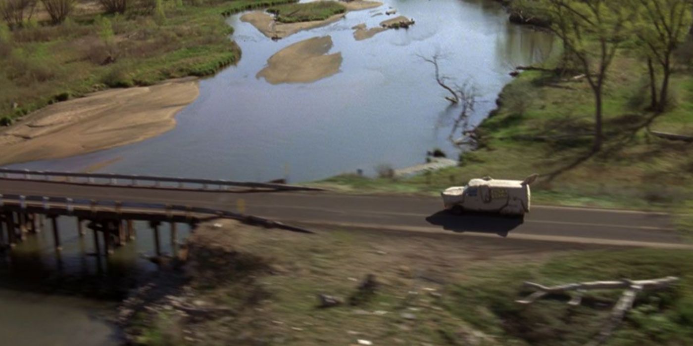 A shot of Harry and Lloyd's van driving down a road in Dumb & Dumber.