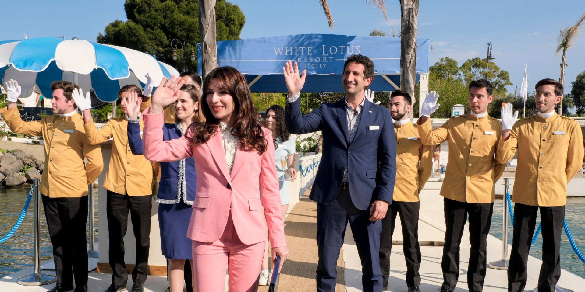 The staff led by Sabrina Impacciatore as Valentina waving in The White Lotus season 2