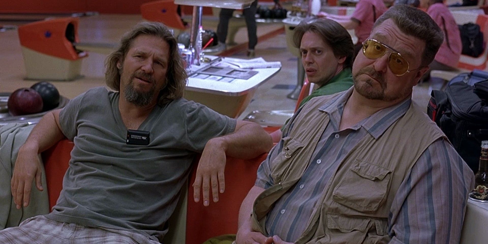 The Dude, Walter, and Donny sitting in a bowling alley in The Big Lebowski
