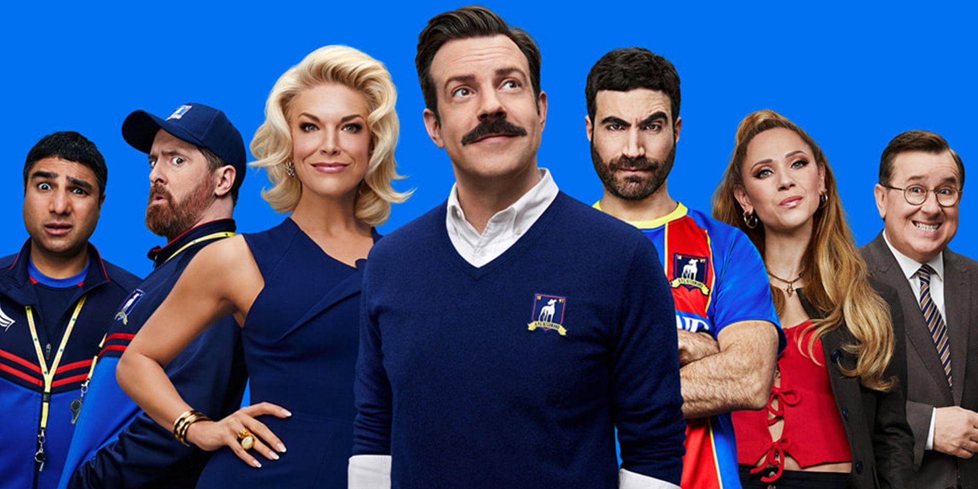 O elenco de Ted Lasso pose juntos em um pôster para o show com um fundo azul