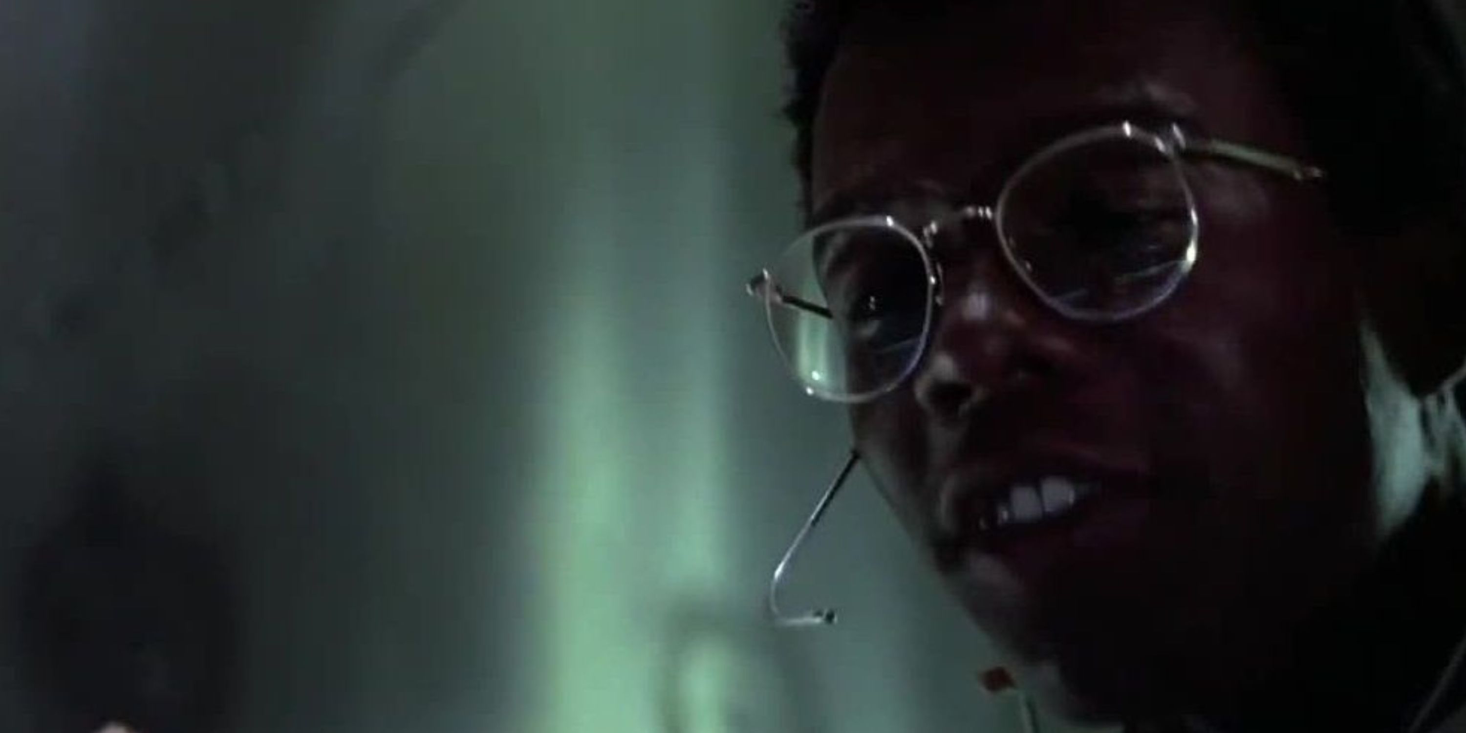 Theo talking into a headset in Die Hard