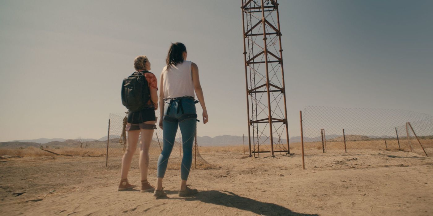 Two women looking at a tower in Fall