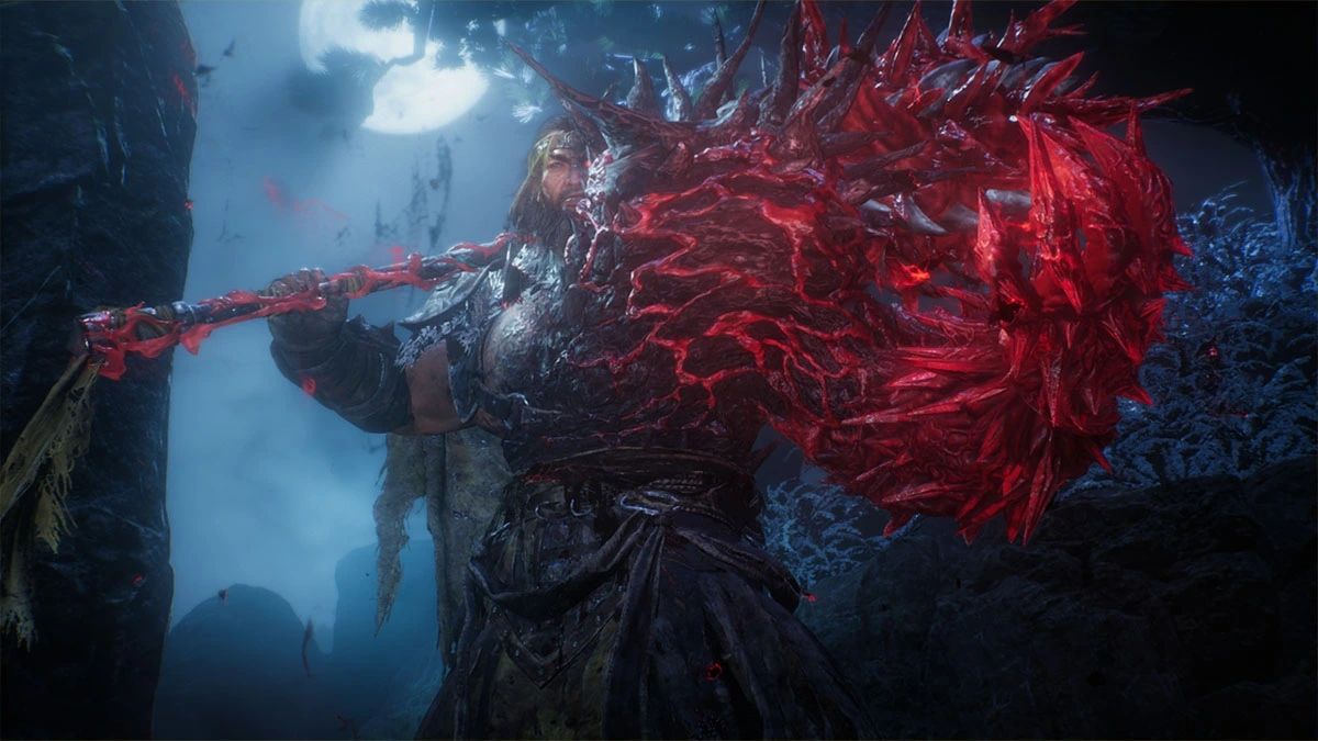 Wo Long: Fallen Dynasty's Zhang Liang in Phase 2, in which half of his body is altered.  His left arm is now a red beastly claw and his weapon is consumed by the same energy.