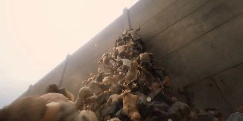 Zombies climbing over each other up a wall in World War Z