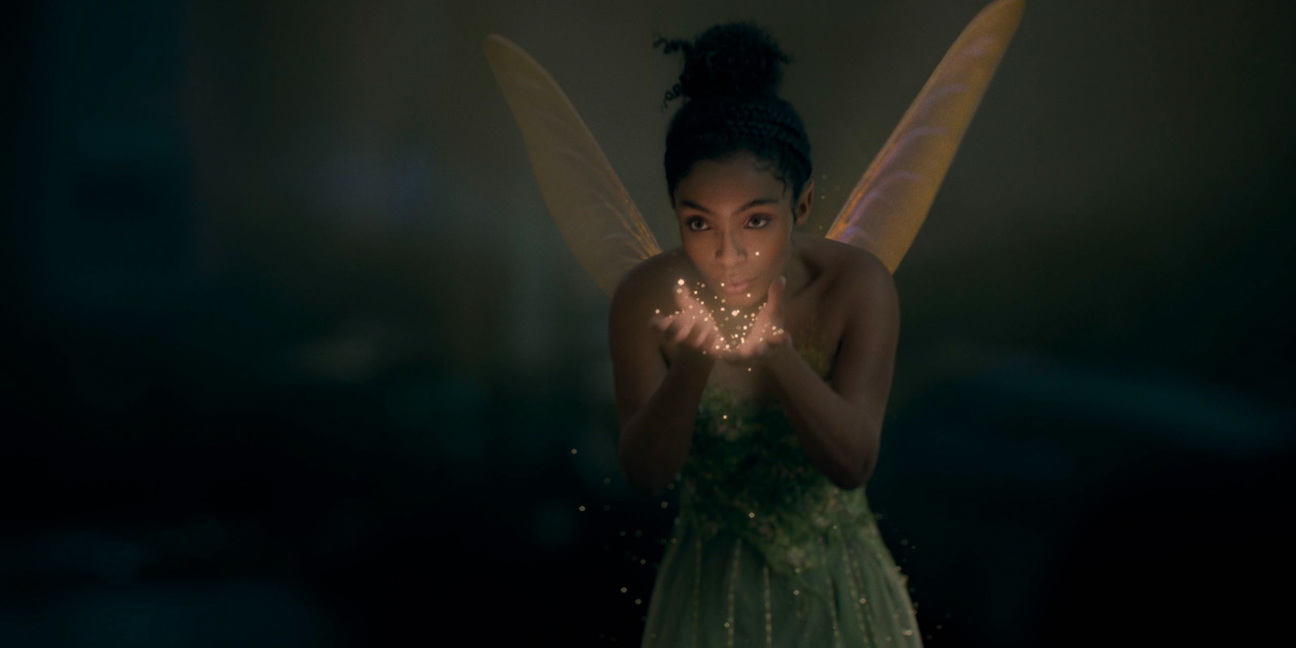Yara Shahidi as Tinkerbell with pixie dust in Peter Pan and Wendy