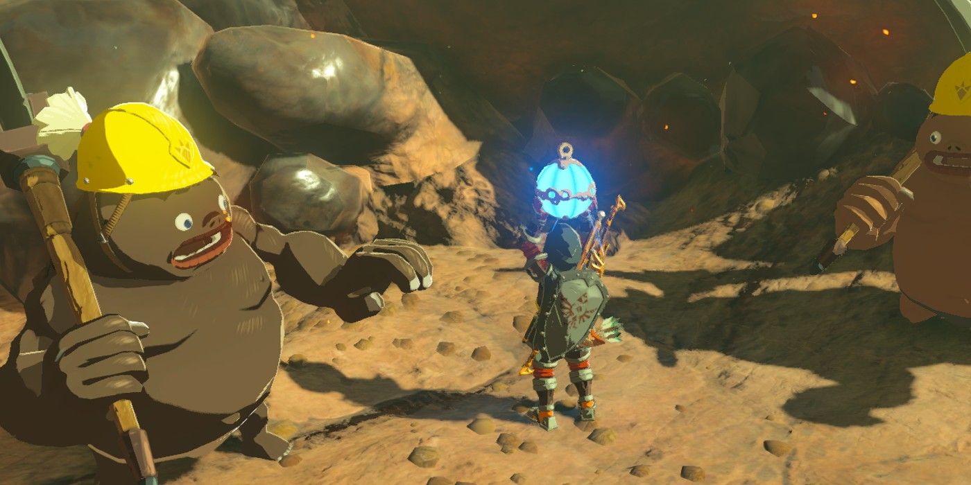 Link holding a bomb and shocking two Goron miners in The Legend of Zelda: Breath of the Wild.