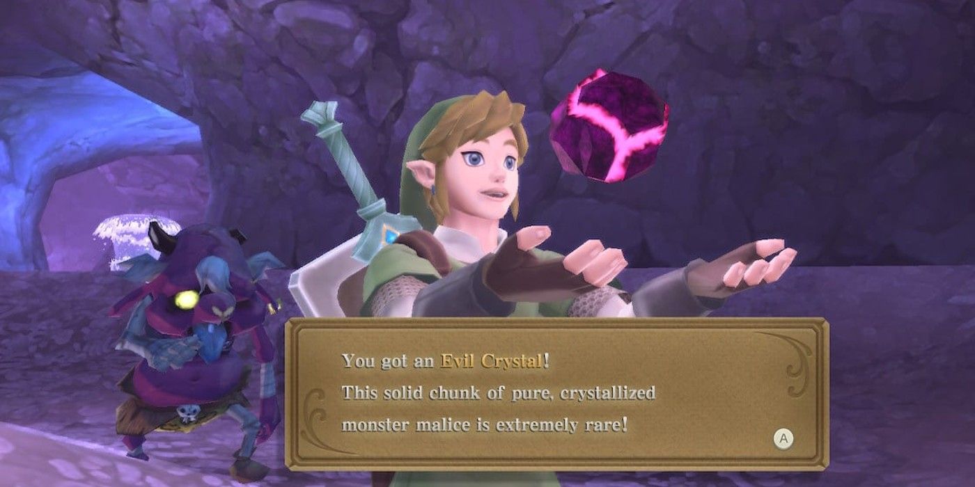 Link obtaining an Evil Crystal in The Legend of Zelda: Skyward Sword, with a Cursed Bokoblin in the background.