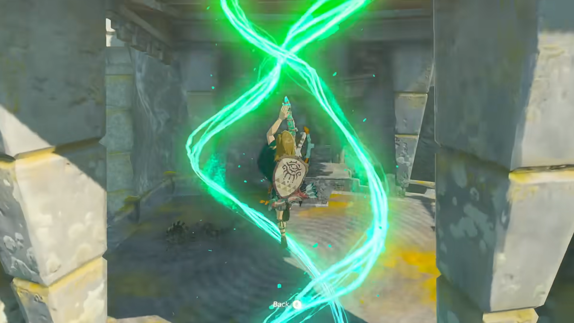 A screenshot from The Legend of Zelda: Tears of the Kingdom showing Link using the Ascend ability. He appears to be diving up through the air surrounded by magical green swirls, aiming to phase through the ceiling of the structure he&rsquo;s in.