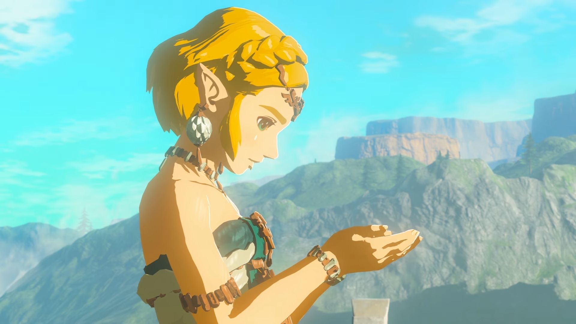 Princess Zelda dalam Tears of the Kingdom, menatap tangannya yang ditangkupkan.