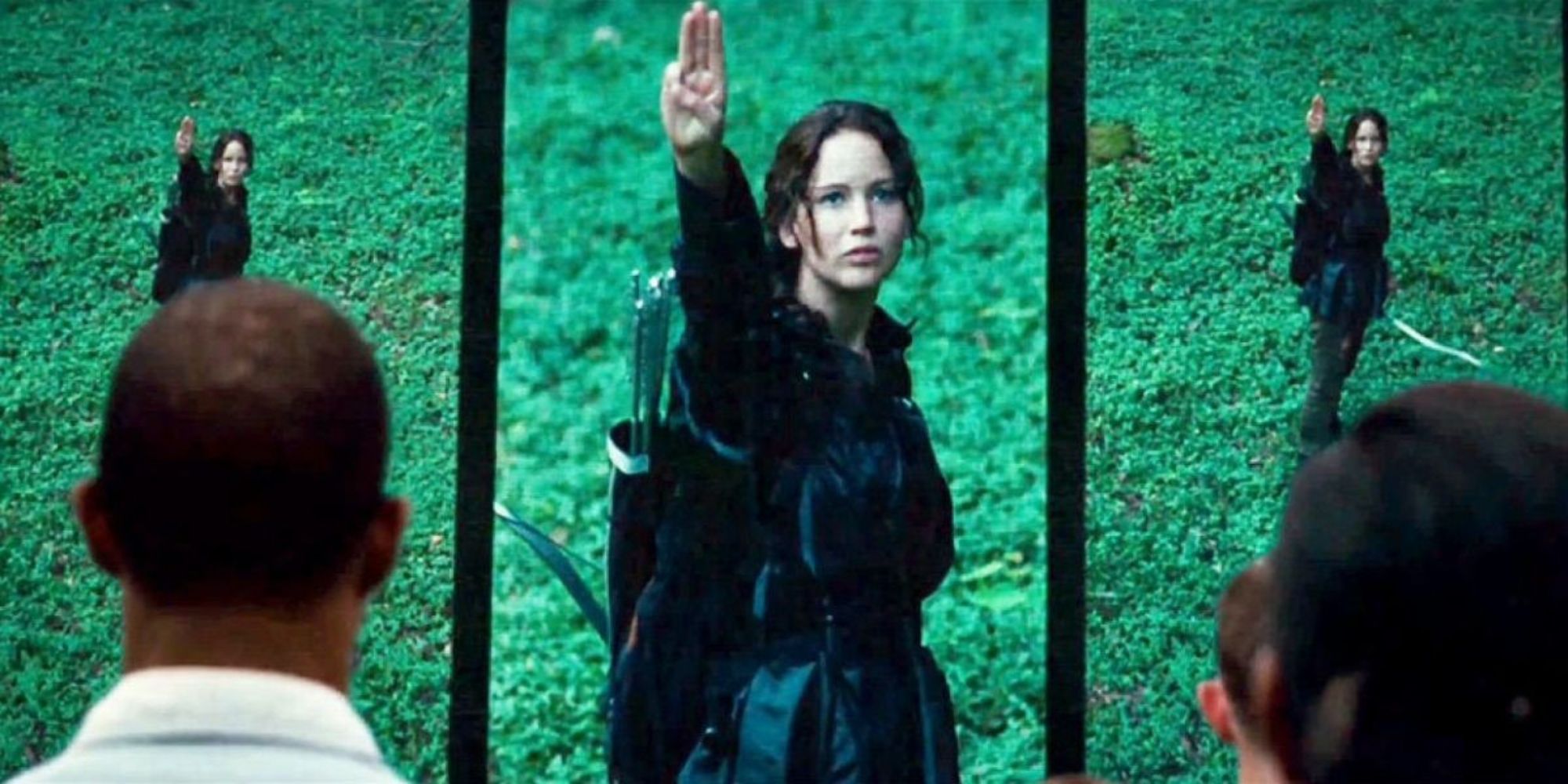 Katniss doing the three finger salute after Rue's death in The Hunger Games